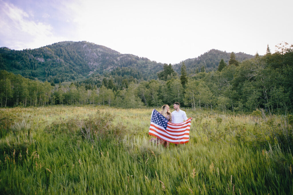 Poppy & Hive Photography captures an intimate summer wildflower engagement session near Snowbasin Resort in Eden Utah