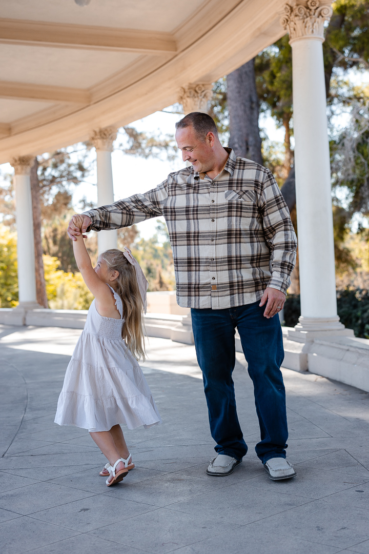 Captured by Poppy & Hive Photography, San Diego Balboa Park Family Sessions: The Downs Family | Category: Families | Keywords: People, Happiness, Smile, Social group, Event, Leisure, Child, Fun, People in nature, Family, Dress, One-piece garment, Love, Waist, Spring, Day Dress, Clothing, Photograph, Sleeve, Plaid, Interaction, Vacation, Blond, Pink, Leg, Shoe, Standing, Holding hands, Toddler, Trousers, Jeans, Denim, Ruffle, Baby & Toddler Clothing, White, Fashion, Sandal, Brown hair, Summer, Facial expression, Eye, Ear