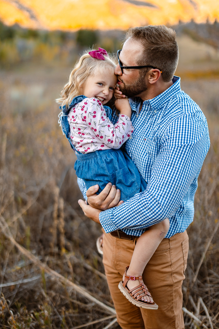 A beautiful family enjoys their family photo session with photographer Poppy & Hive Photography in the fall colors near Park City Utah