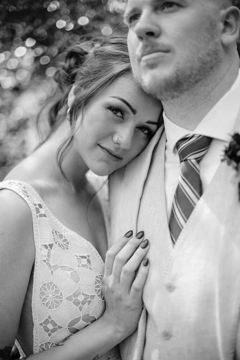 Black and white image of a bride and groom celebrating their wedding in the mountains with their photographer near Salt Lake City and Park City Utah