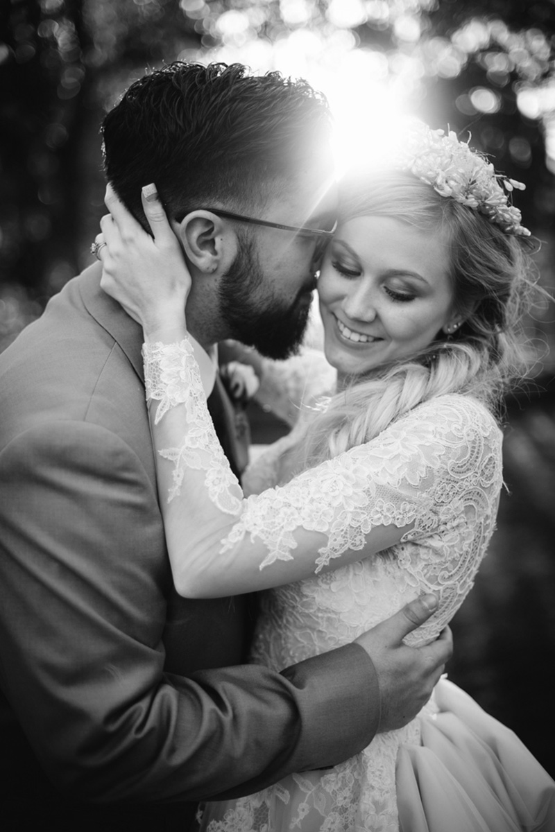 Black and white image of a bride and groom celebrating their wedding at Wadley Farms with their photographer near Salt Lake City and Park City Utah