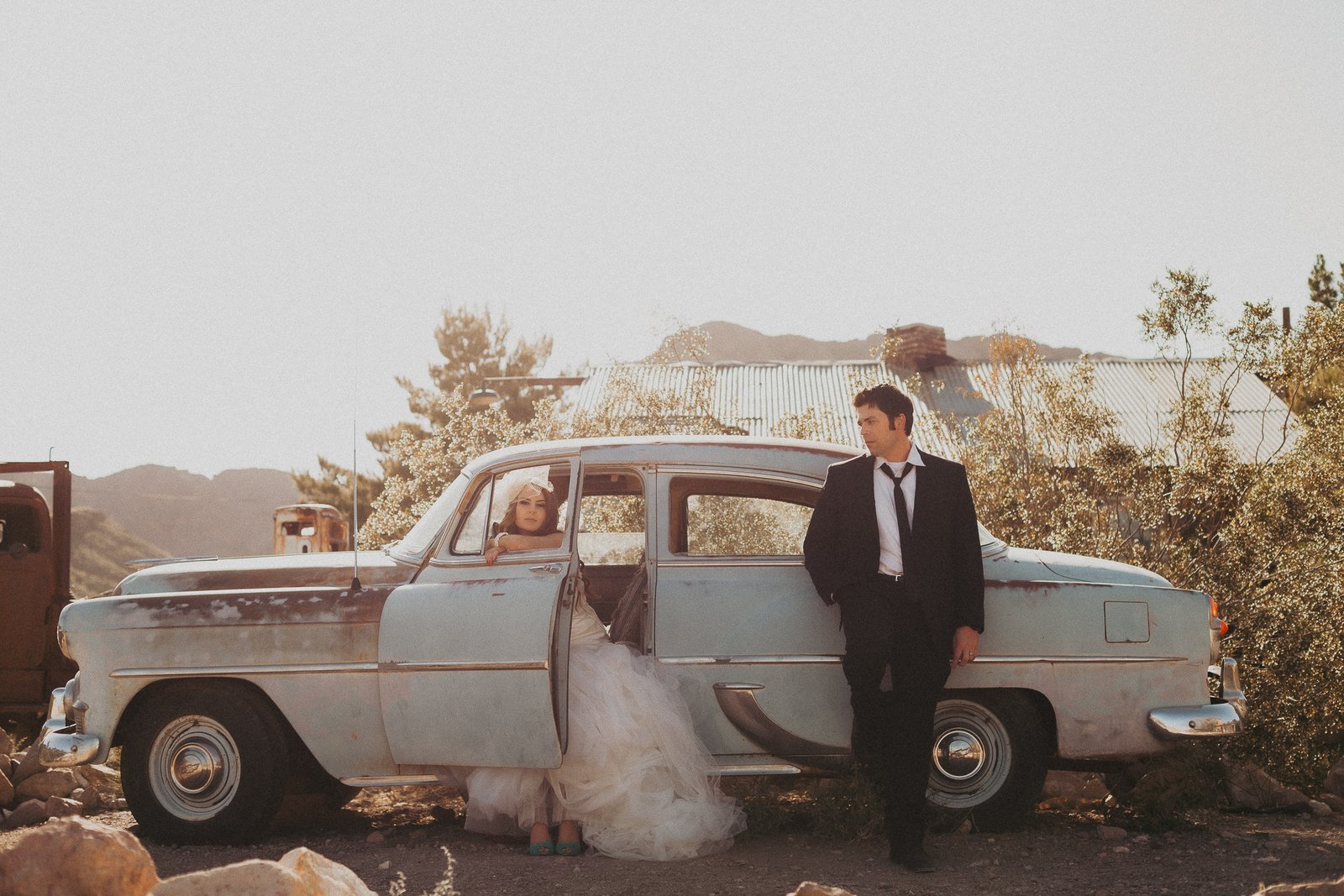 A newly married couple celebrates their wedding during a day-after photography session at a ghost town near Las Vegas
