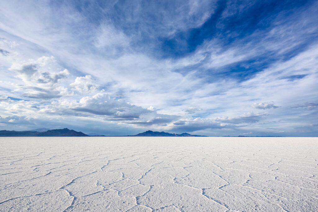 The surreal white expanse of the Bonneville Salt Flats offers a unique and minimalist backdrop for a truly unforgettable Utah elopement.