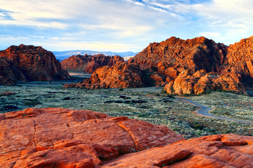 Snow Canyon State Park's red rock cliffs, lava fields, and sand dunes provide a stunning variety of backdrops for a picturesque Utah elopement.