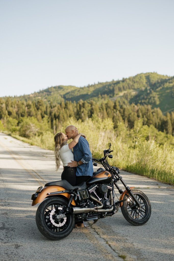 Motorcycle-themed engagement shoot with Poppy & Hive Photography. Engagement session on Old Snowbasin Road near Snowbasin Resort in Utah.