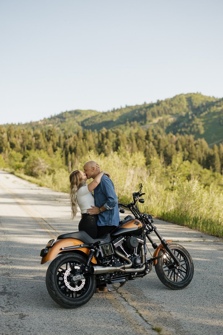 Motorcycle-themed engagement shoot with Poppy & Hive Photography. Engagement session on Old Snowbasin Road near Snowbasin Resort in Utah.