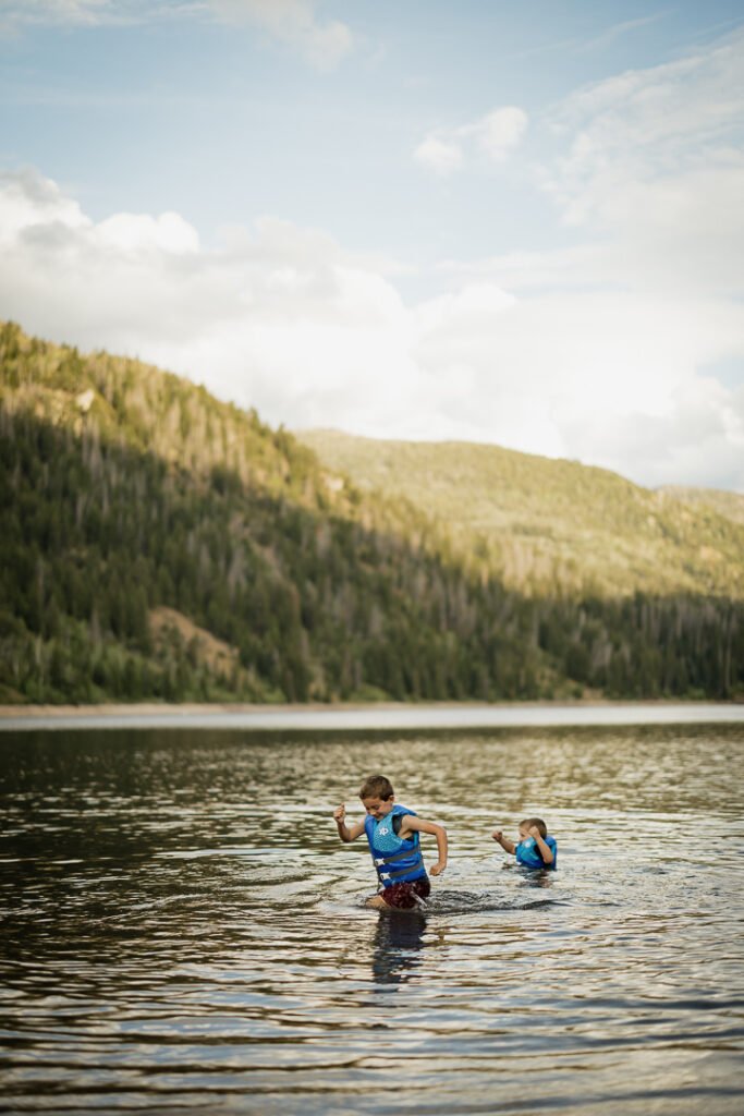 The Carney family enjoys an afternoon adventure at Smith & Morehouse reservoir in northern Utah for their summer family photo session