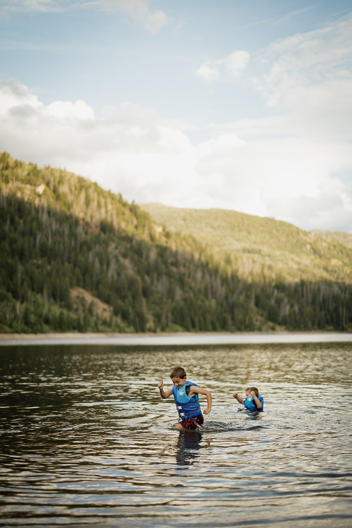 The Carney family enjoys an afternoon adventure at Smith & Morehouse reservoir in northern Utah for their summer family photo session