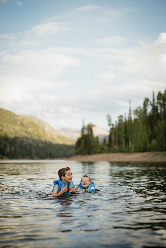The Carney family enjoys an afternoon adventure at Smith & Morehouse reservoir in northern Utah for their summer family photo session