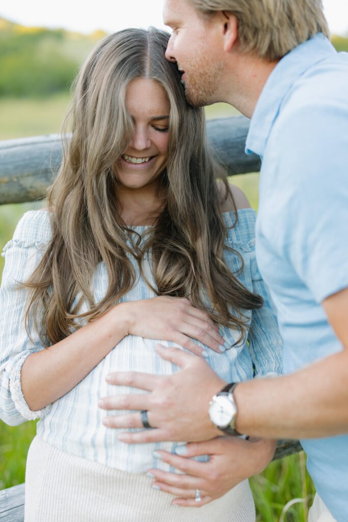 Lauren and Ben celebrate their new baby with a maternity photo session in a wildflower field near Salt Lake City with Poppy & Hive Photography